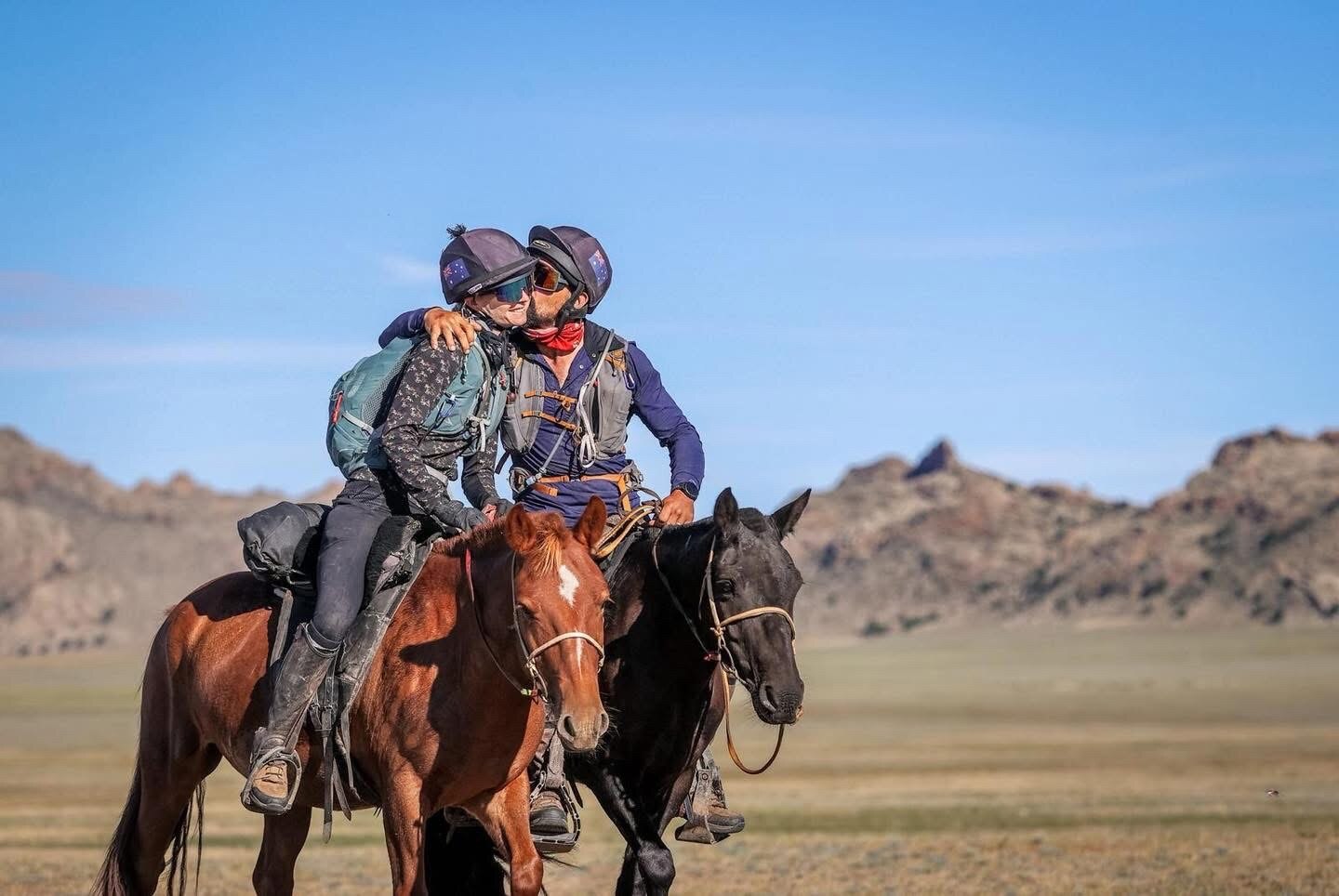 The Fiore's share a kiss on horseback during the ride.