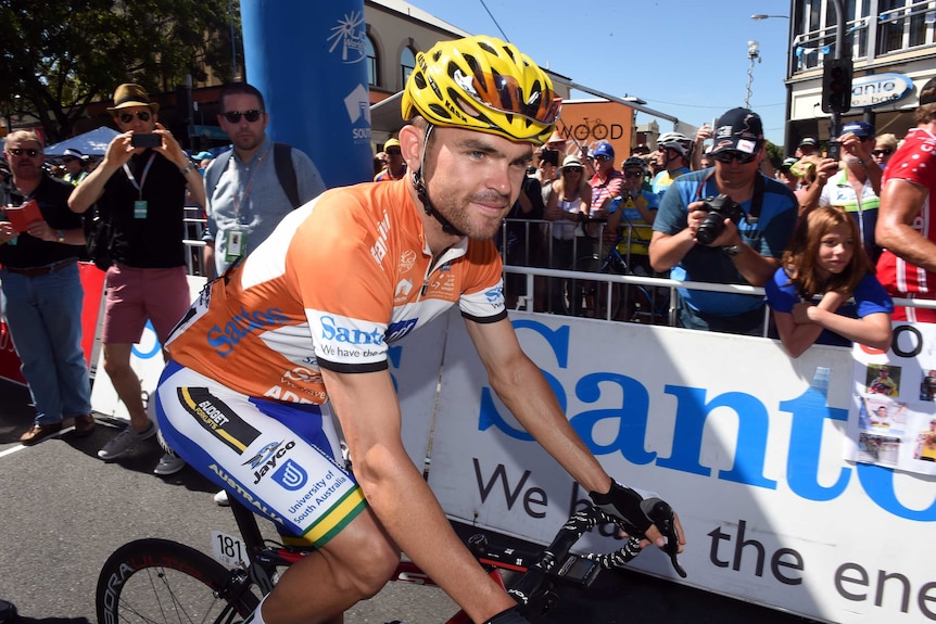 Australian rider Jack Bobridge sits on his bike with fans behind him at the start of Stage 3 of the Tour Down Under.