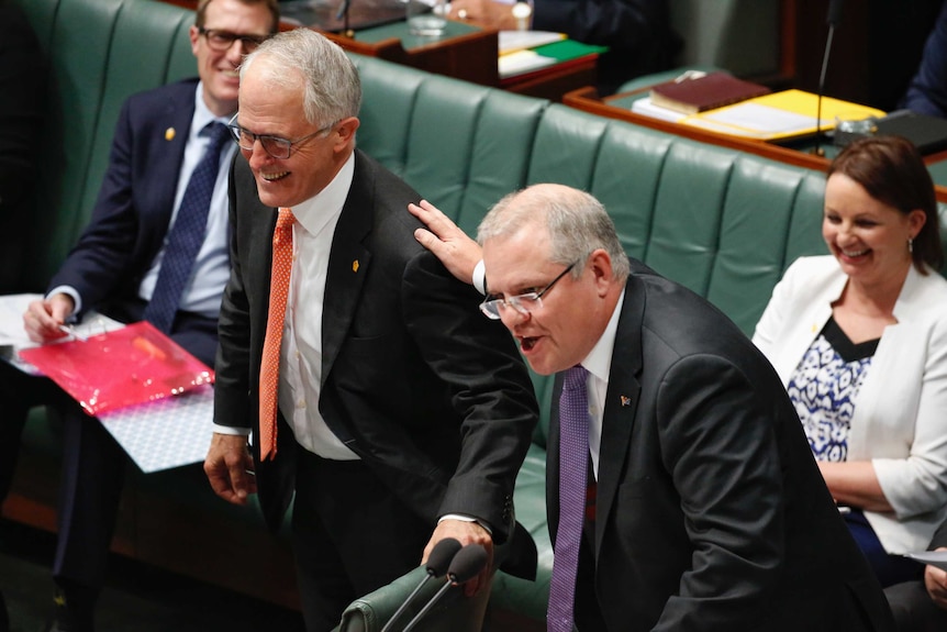 Prime Minister Malcolm Turnbull and Treasurer Scott Morrison appearing jovial during the first Question time back