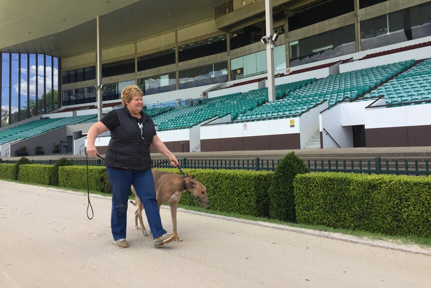Trainer Annette Fleming with her dog Jet at Wentworth Park.