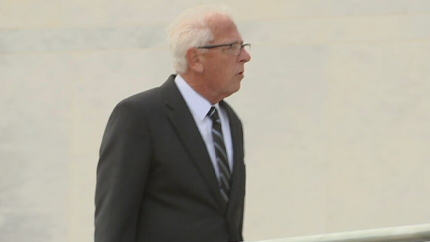 Peter Cuzner walking towards the ACT Supreme Court.