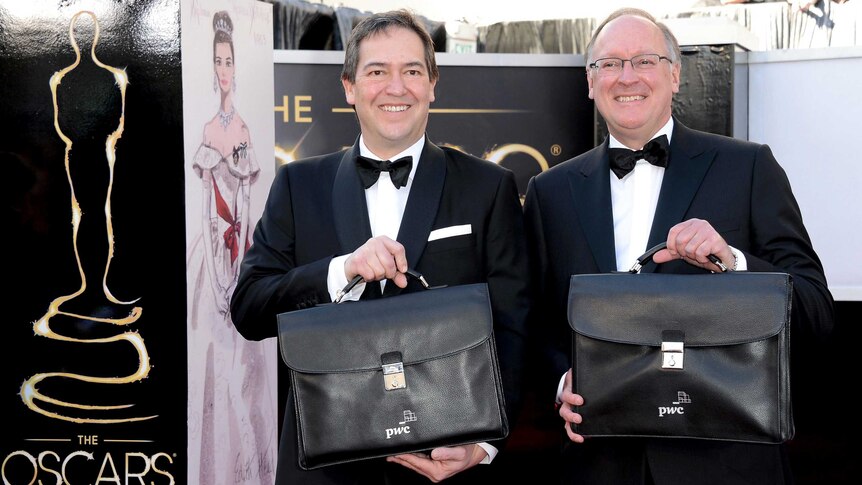 PricewaterhouseCoopers representatives arrive at the 2013 Oscars.