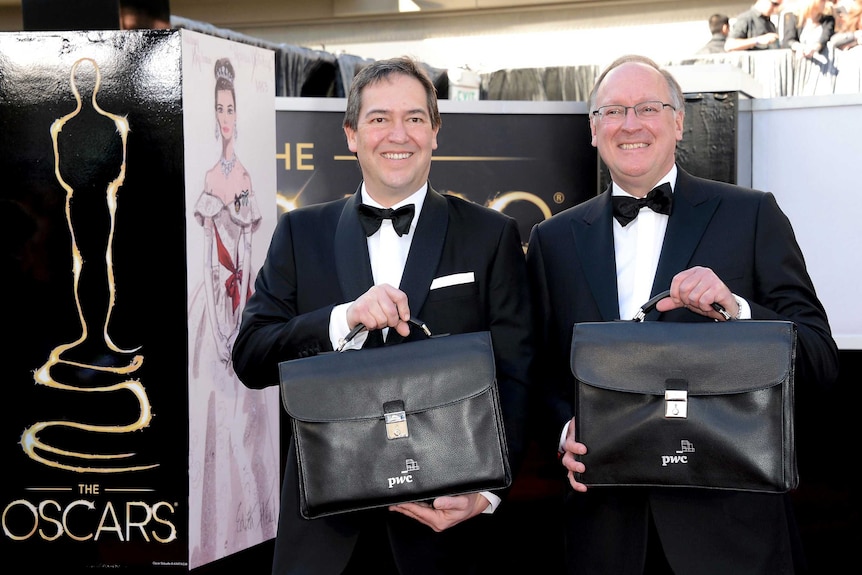 PricewaterhouseCoopers representatives arrive at the 2013 Oscars.