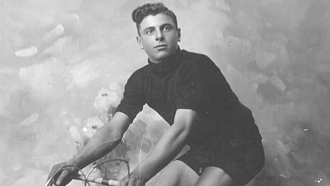 Attilio Pavesi poses for a photo on his bike