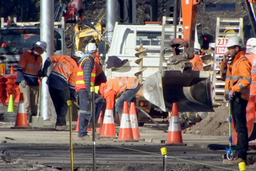 Construction workers on St Kilda Road on July 6, 2017, as part of the Metro Tunnel works.
