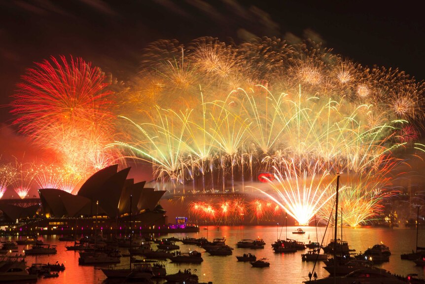 Fireworks fill the sky above Sydney Harbour, as seen from Mrs Macquaries Point, during New Year celebrations.