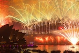 Fireworks fill the sky above Sydney Harbour, as seen from Mrs Macquaries Point, during New Year celebrations.