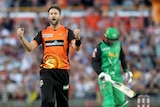 Andrew Tye pumps both fists in celebration of a wicket for the Perth Scorchers.