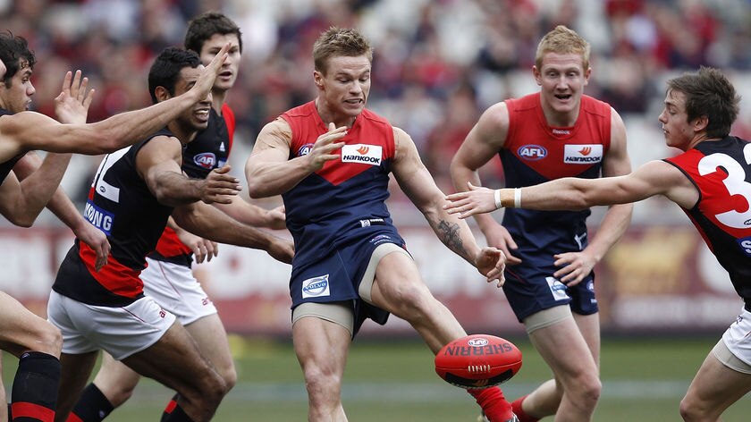 Bombers buried...Melbourne's Colin Sylvia kicks clear during his team's win.