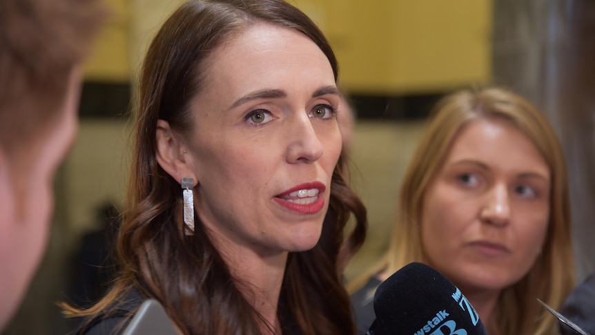 Jacinda Ardern speaks to reporters.