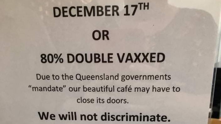 Picture of a sign that reads: "Due to the Queensland Government's "Mandate" our beautiful cafe may have to close" 