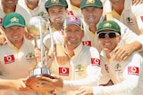 Michael Clarke and his team celebrate with the Border-Gavaskar Trophy after victory in Adelaide.