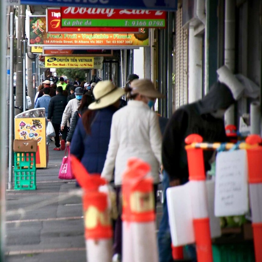 A street in Brimbank is crowded with people during the day.