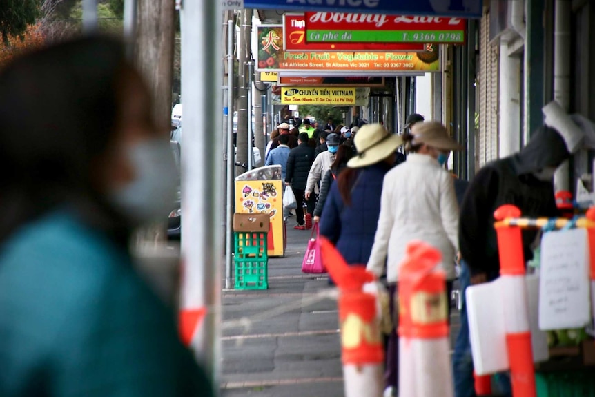 A street in Brimbank is crowded with people during the day.