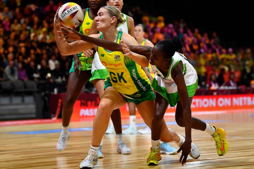 A Diamonds players challenges for possession against a Zimbabwe opponent.