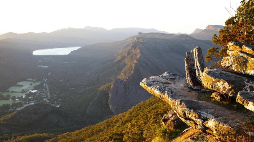 Mountains and forest is seen from a high lookout.