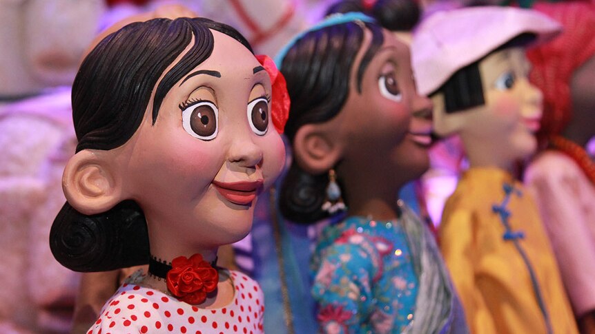 Smiling, big-eyed, female figurines from the Make Believe: The Story of the Myer Christmas Windows exhibition.