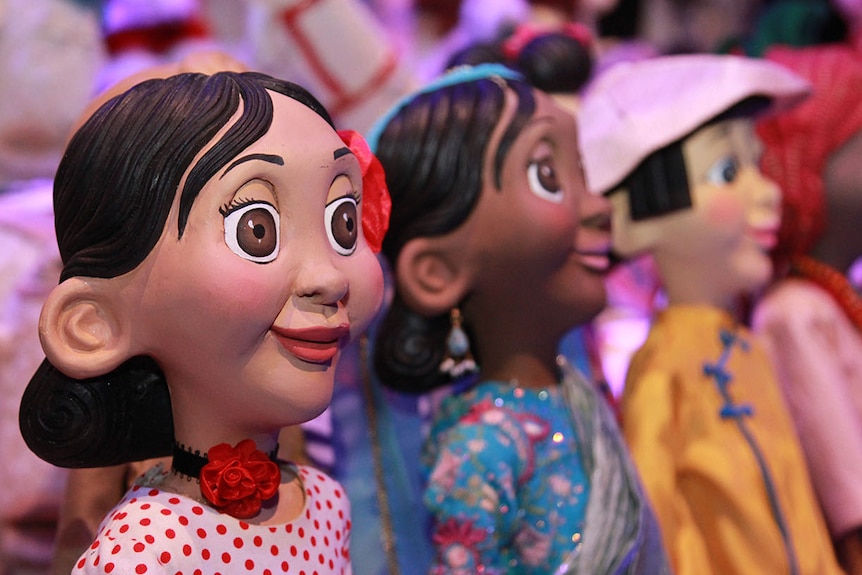 Smiling, big-eyed, female figurines from the Make Believe: The Story of the Myer Christmas Windows exhibition.
