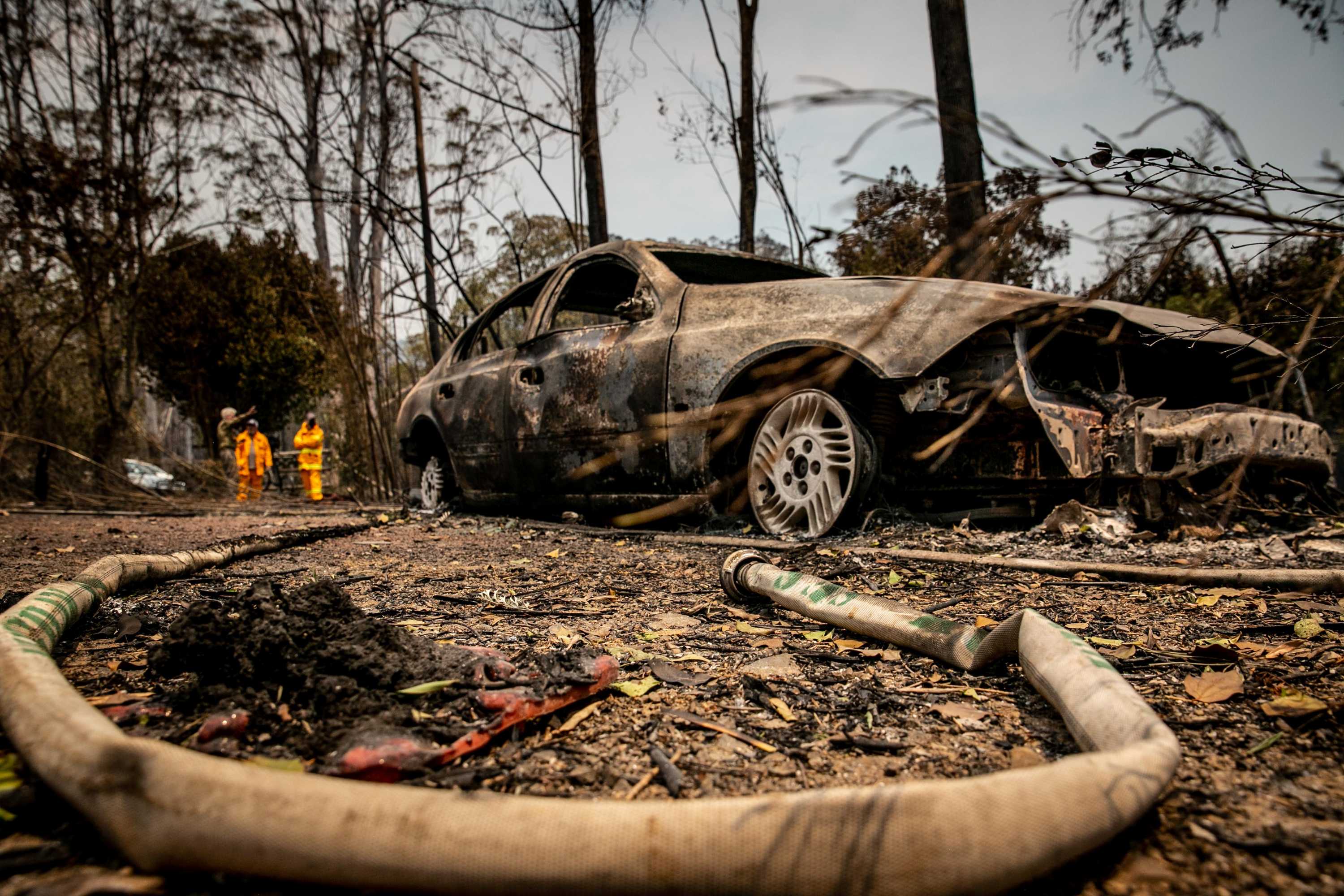 A burnt out car after a bushfire.