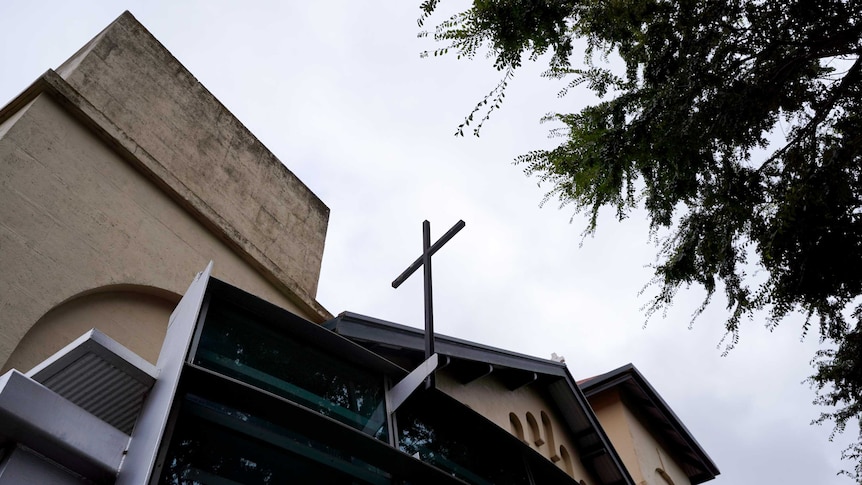 An iron cross stands on top of the entrance to Saint Joseph's Catholic Church in Penola.