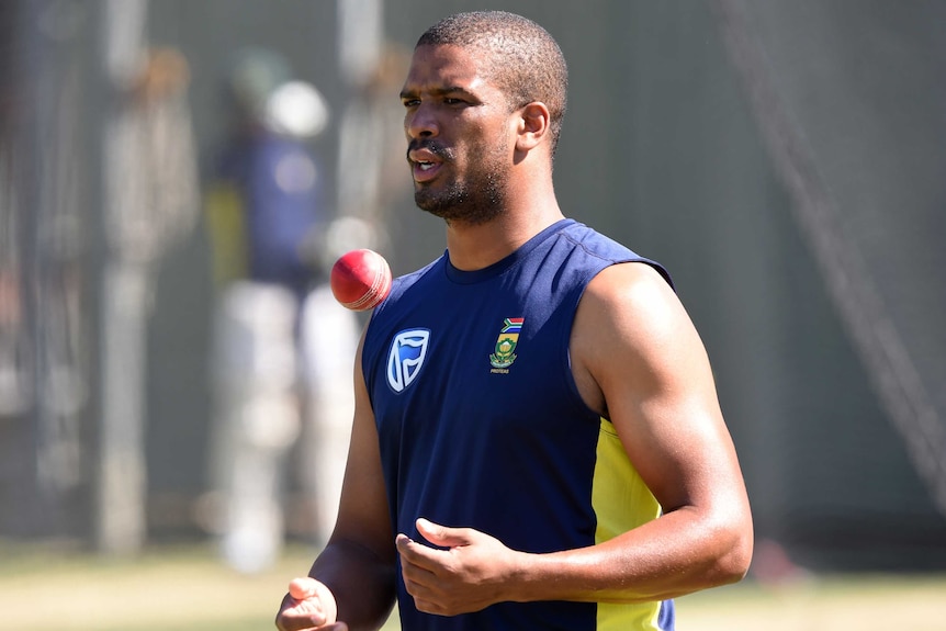 Vernon Philander looks on at training at the WACA in Perth while throwing a cricket ball into the air.