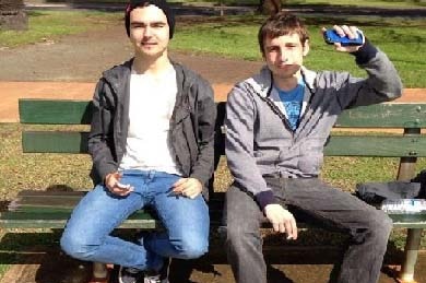 Missing man Jake Lyons with a friend on a park bench