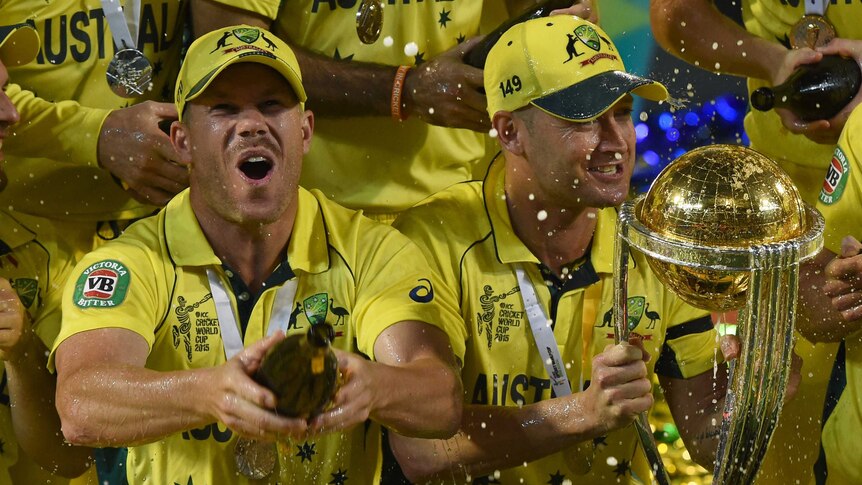 David Warner and Michael Clarke celebrate with World Cup