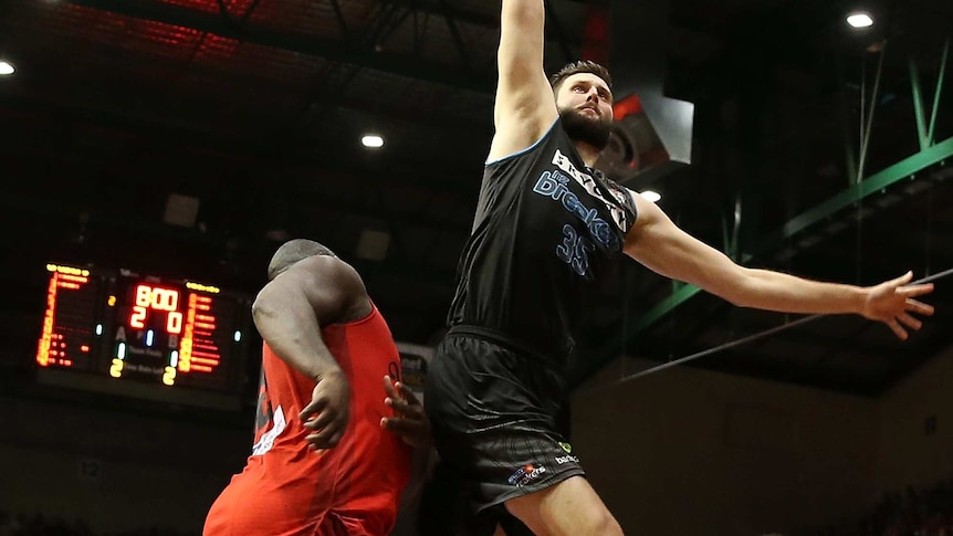 Alex Pledger shoots for the basket for the Breakers