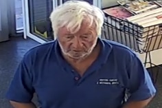 A CCTV picture of a white-haired man wearing a blue shirt.