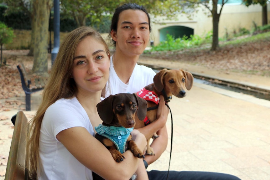 Chloe Christos, with her boyfriend Key Nathan and their dogs.