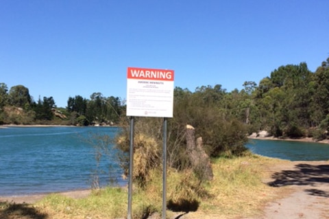 Warning sign in front of a natural swimming pool in Collie Shire