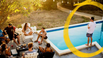 A group of people by the pool.