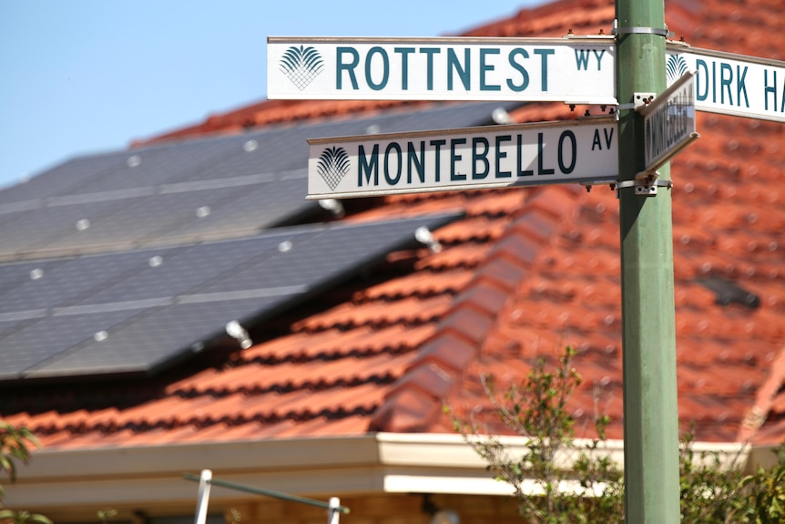 A group of street signs with one saying 'Montebello Avenue'.