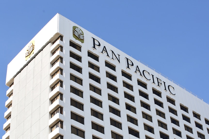 The Pan Pacific hotel in Perth. A low angle looking at the north-west coroner of the white building.