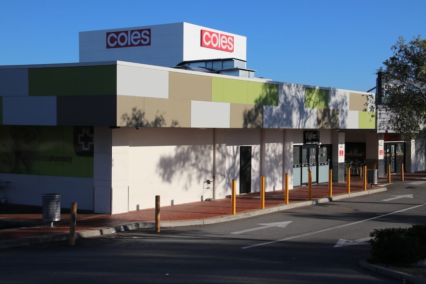 A photo of the exterior of a shopping centre with a 'Coles' sign on the roof.