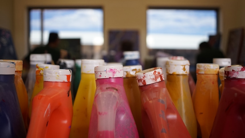 bottles of paints inside the prison's art classroom 