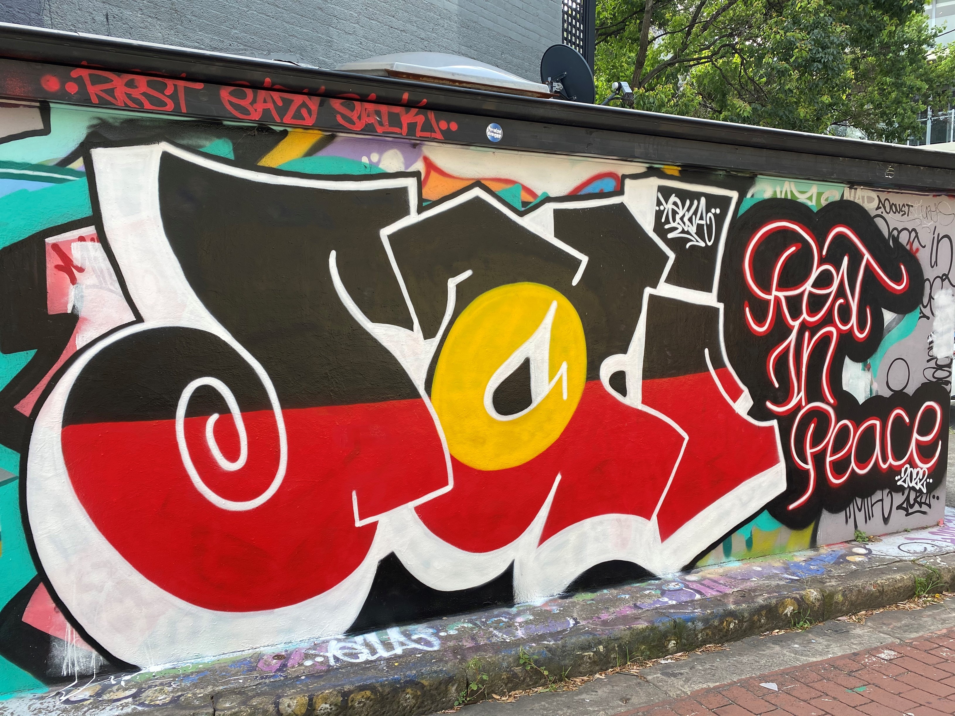 A mural painted in graffiti style on a wall. 