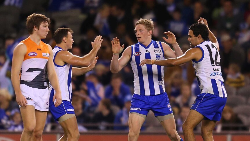 Kangaroos' Jack Ziebell celebrates a goal against GWS at Docklands in June 2013.