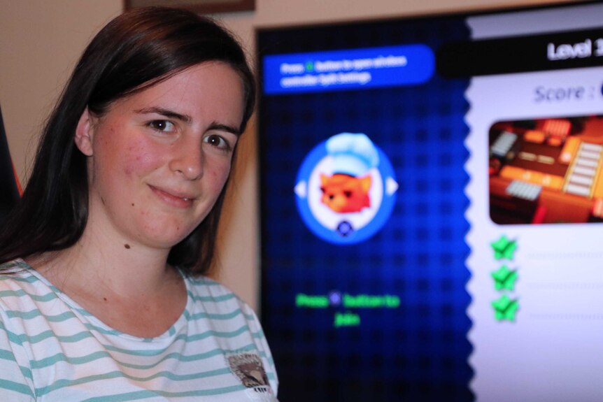 A head and shoulders shot of former high school physics teacher Megan Pusey in front of a computer screen.