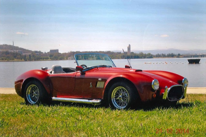 The red home-built AC Cobra in front of Lake Burley Griffin last month.
