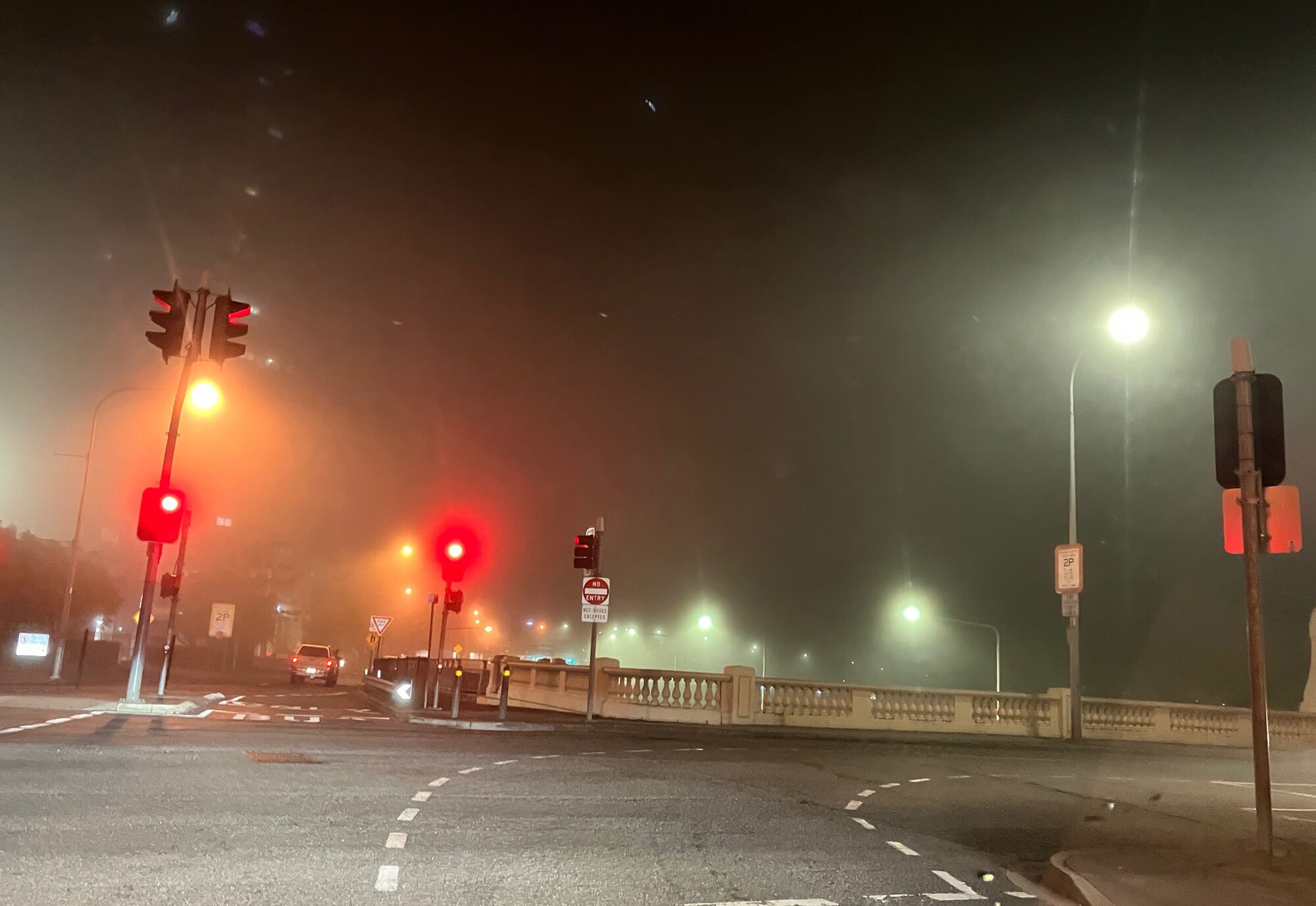 Brisbane CBD lost in fog from the William Jolly Bridge