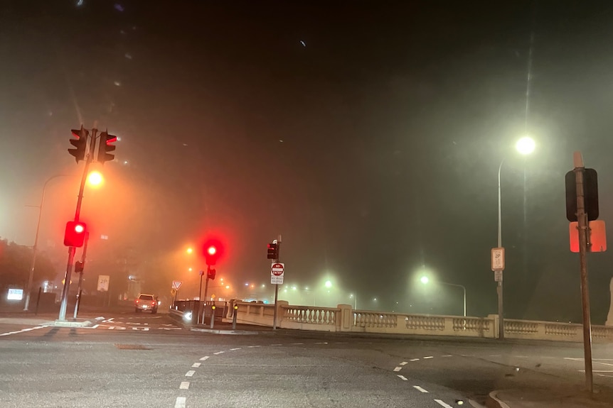 Brisbane CBD lost in fog from the William Jolly Bridge