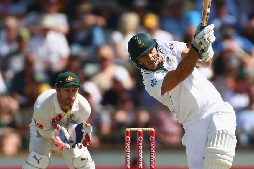 Impenetrable... Faf du Plessis hits out as Matthew Wade looks on.