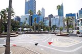The empty Elizabeth Quay water park, with Perth's CBD in the background.
