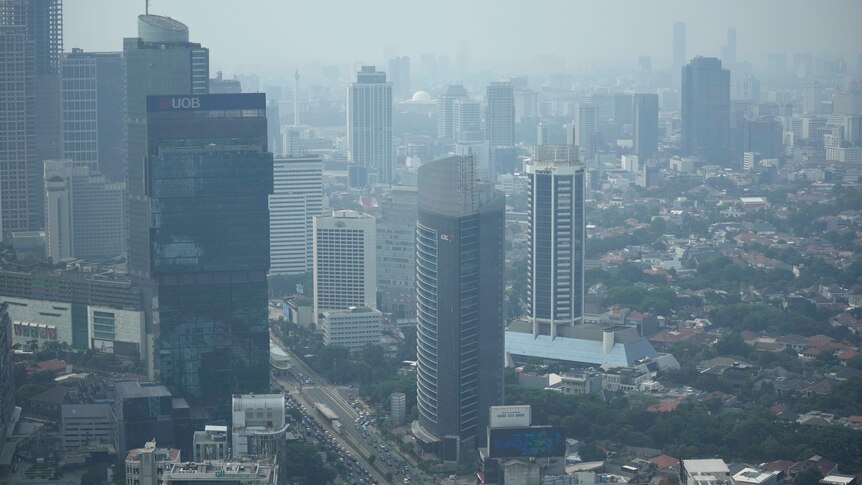 Drone shot of Jakarta covered in a smog.