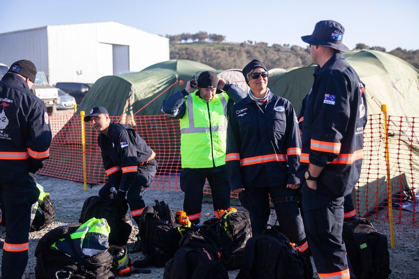 A group of people in search and rescue uniforms.