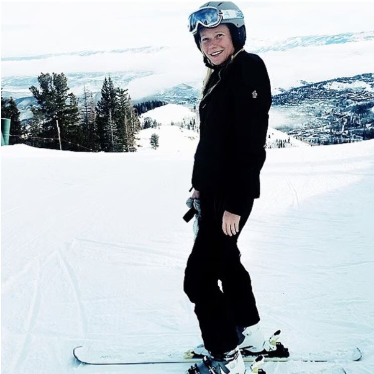 Gwyneth Paltrow in ski clothes on top of a snowy slope