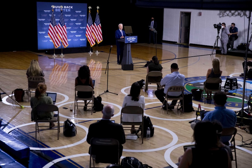 Democratic presidential candidate former Vice President Joe Biden speaks in front of a small crowd