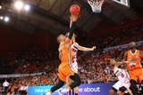 Scott Machado goes for a contested lay-up against the Perth Wildcats at a Taipans home game.