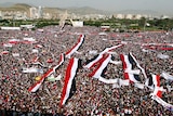 Yemenis wave the national flag during a gathering in support of the Huthi-led parliament in the capital Sanaa on August 20 2016.